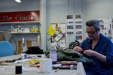 Member of Sheffield Theatres wardrobe department sewing an item of costume